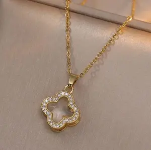 Trendy 18-k gold pendant necklace adorned with crystals and diamonds, stainless steel clavicle chain.