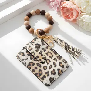 Fashionable Boho Style Tassel Beaded Keychain, featuringa wallet and bracelet function, perfect as a birthday giftfor women and girls, and a perfect match for everydayoutfits.