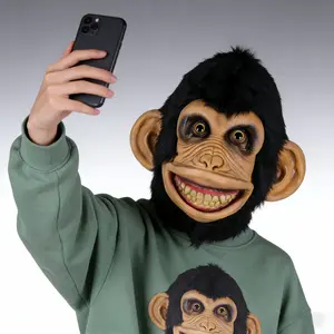 Social media sensation: A quirky chimp latex mask featuring dense, realistic black plush fur, a wide toothy grin, and highly realistic latex facial wrinkles. Perfect for birthday parties, short videos, animal cosplay parties, Halloween carnivals
