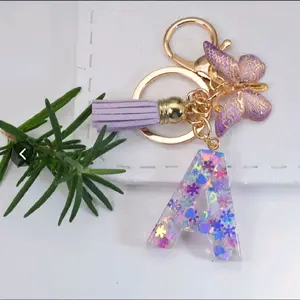 Butterfly Keychain with Letter M, Purple Tassel, and Colorful Design