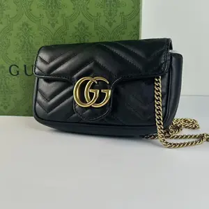 Pre-owned GUCCI Black Quilted Mini Bag with Gold Chain Strap and GG Logo