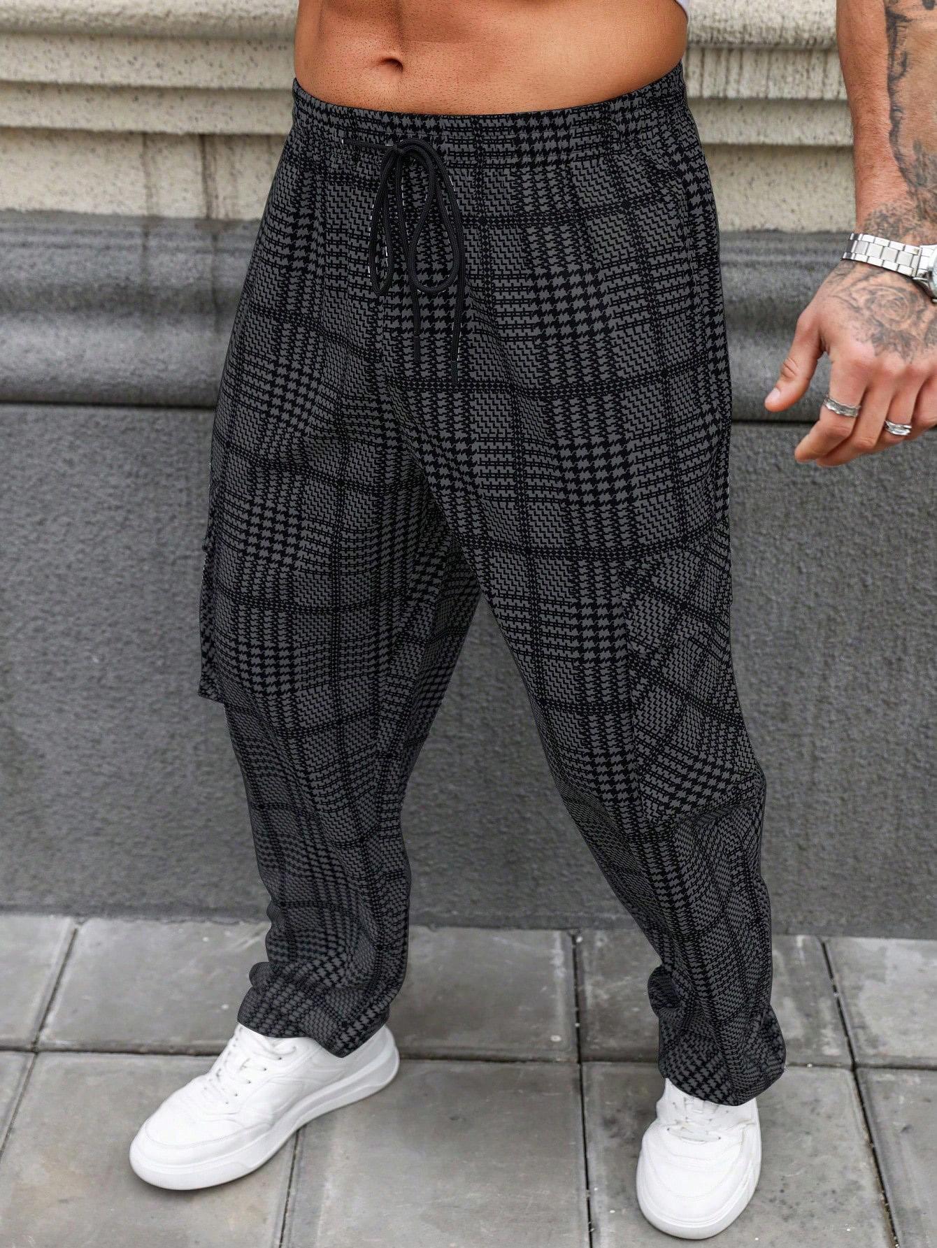 Men’s black and white houndstooth wide straight-leg pants with an elastic drawstring waist and side pockets; lightweight, breathable, loose fit; casual street style for everyday wear, vacations, and home.