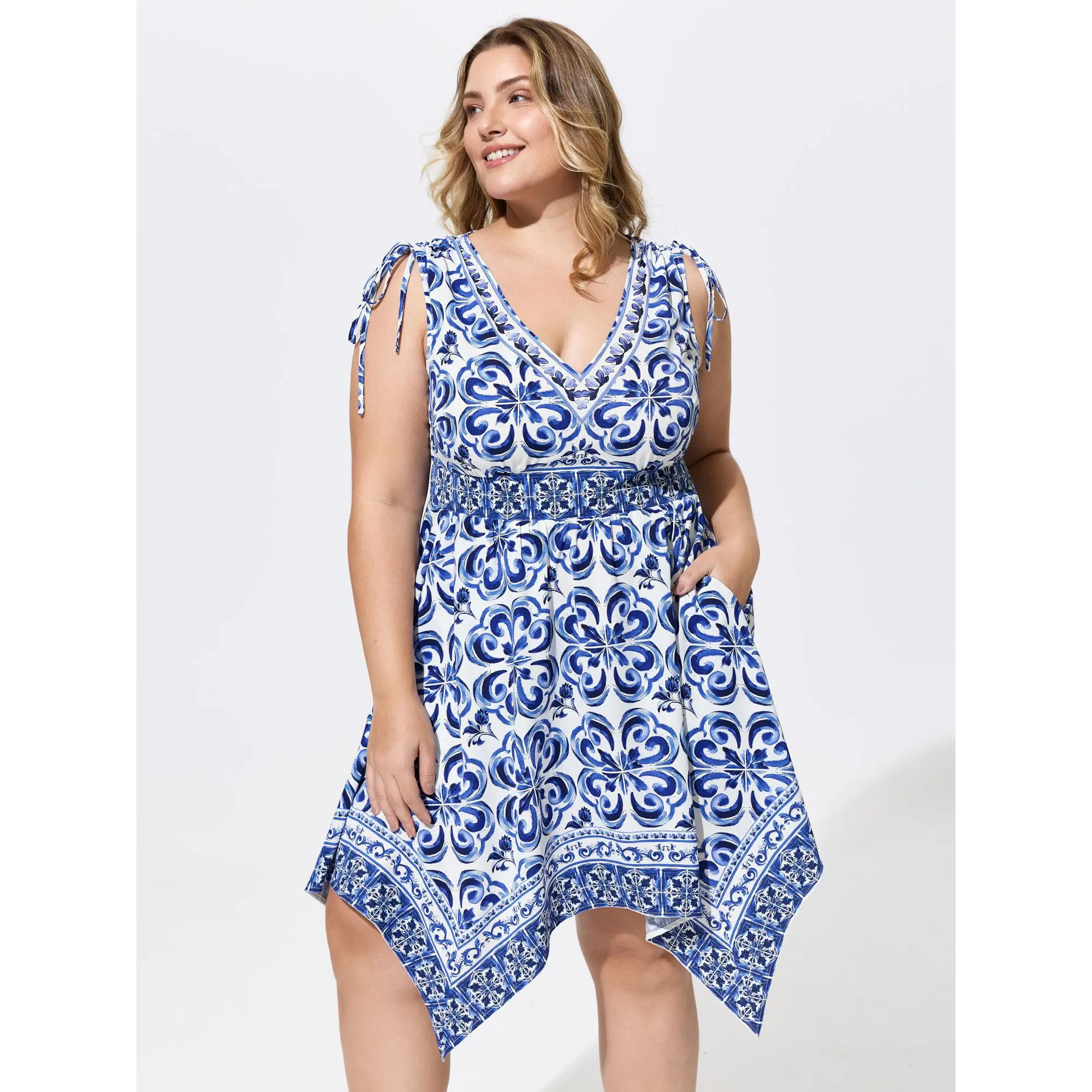 BloomChic Plus Size Ethnic Floral Resort Wear Dress, a Sleeveless Garment with a Flattering Fit, Smocked Waist and Asymmetrical Hem