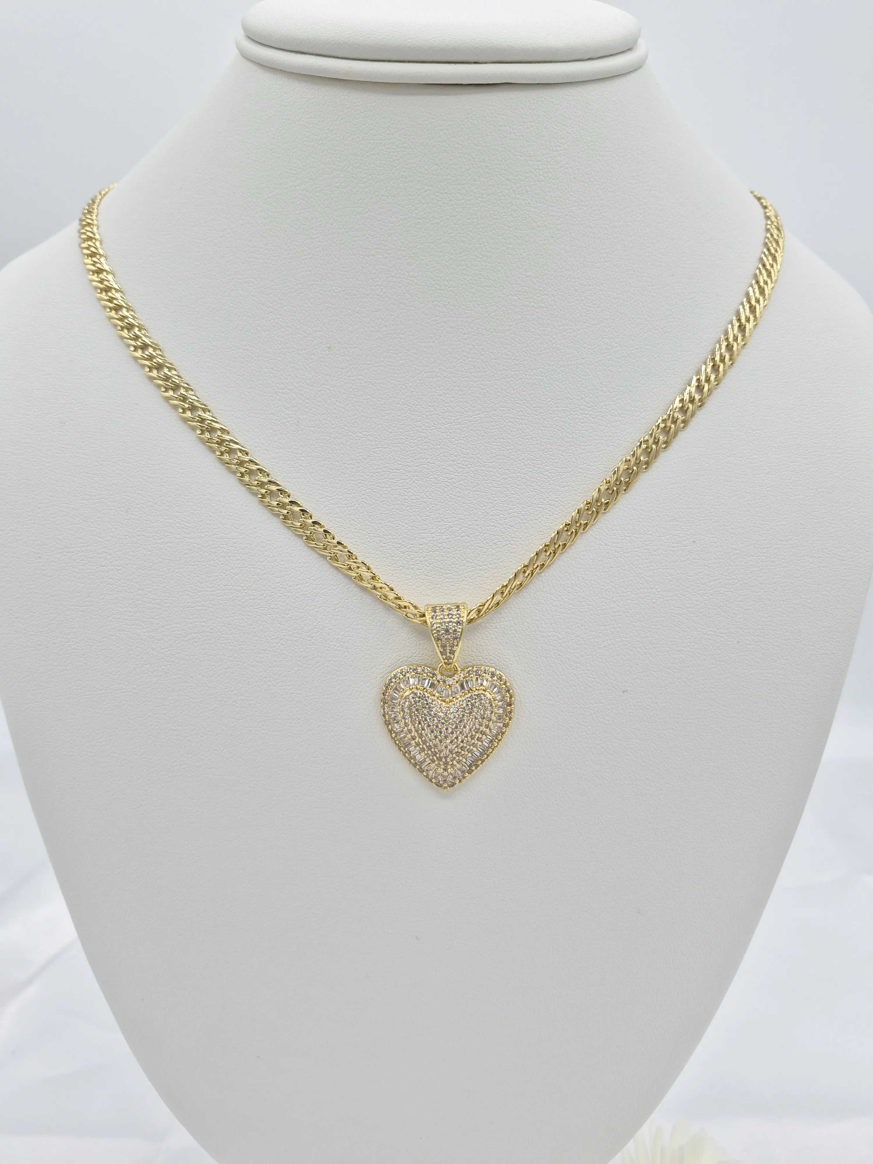 Spanish style chain heart shaped charms featuring zirconia in 14k gold plated.(44)