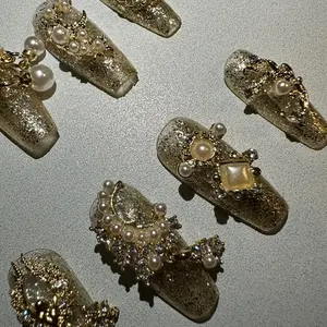 coffin shape medium length handmade press on nails with golden elements and modern design nail art pearl gemstones rhinestones dazzling holiday nails Manicure Cosmetic Nail Polish Polish Nail Care