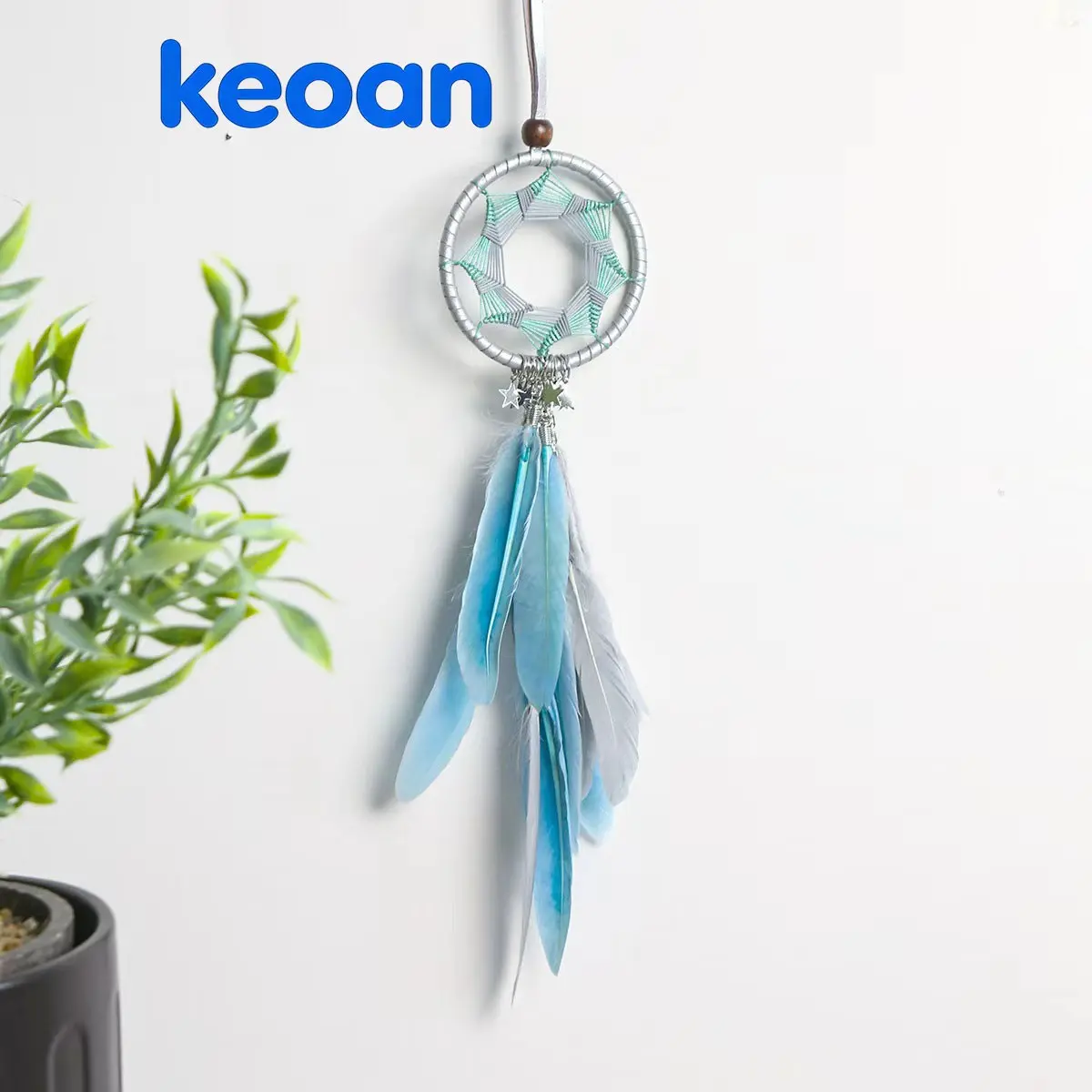 A blue dreamcatcher with light blue feather pendants at the bottom symbolizes filtering out nightmares and leaving only beautiful dreams. It is very suitable as a room decoration, bedside decoration, car accessory, or as a gentle little gift for friends.