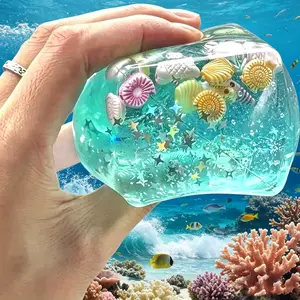 2 Pack Ocean Themed Squishy Toy, 3D Seashell Starfish Cube Squish Fidget Toy, Clear Glitter Transparent Slime Squeeze Toy, Cute Marine Cartoon Ornament, Stress Relief Anxiety Relief Vent Squeeze Toy for Kids Adults