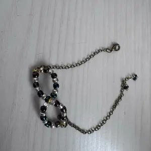 Handcrafted Infinity Symbol Beaded Bracelet – Adjustable Silver & Black Tones