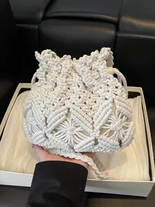 Fashionable and practical texture versatile woven bucket bag, simple style casual personality retro shoulder bag, hollowed out drawstring drawstring design, suitable for beach vacation, shopping, outdoor travel