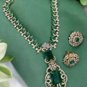 Victorian-style necklace and earring set with emerald green stones and cubic zirconia