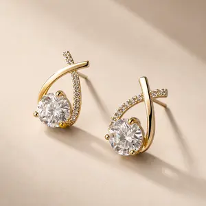 StarTwist Crystal Stud Earrings – Elegant Gold CZ Swirl Drops