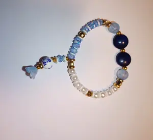 Ocean Whim Beaded Bracelet with Blue White Beads Gold Accents for Women Graceful Question Mark Shape Ornate Beads Floral Charms