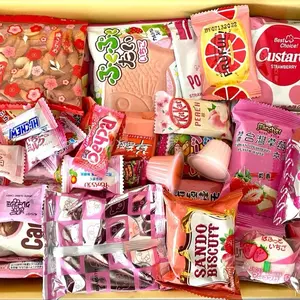 Pink Asian Snack Box with Ramen Drinks Includes Various Candy and Snacks Featuring Strawberry Flavors Sweet Dessert Macarons