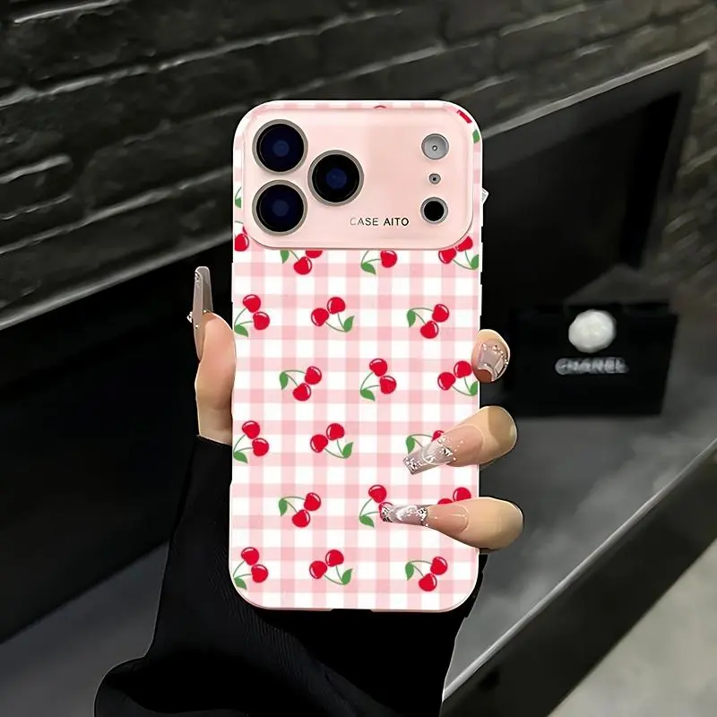 Pink and white checkered cherry pattern phone case. Compatible with iPhone 17 Pro Max, 16 Pro Max, 15 Pro Max, and 14 Pro Max. Includes lens protection. Also compatible with iPhone 15, 14, 13, and 12. Made of skin-friendly TPU material.