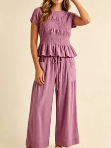Women's Fashion Casual High-End Textured Cotton Ruffled Short Sleeve Two-Piece Set, with waist-cinching ruffles and a flowing wide-leg pant design, perfect for summer, vacations, indoor, and outdoor wear