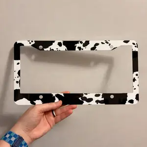 Black & White cow hide aluminum license plate frame. Car, truck , SUV, tag