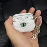 "The White Devil" UV-Reactive Aesthetic Audio Earbuds Shell - Detachable Glow-in-the-Dark Green Eye Cover, Metal-Plastic Build, Charging Port Protection, Clip for AirPods Pro/Pro2/Pro3, AirPods 4