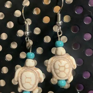 Aesthetic dangly Charm earrings. Whimsical, angel, turtle, dice