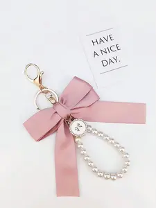 Cute Faux Pearl Decorated Wristlet Keychain, 2025 Summer & Fall Trendy Bowknot & Rhinestone Decor Keychain, Phone Wallet Key Accessories for Women & Girls Car Accessories For Girls bow coquette  keychain Charm Pendant