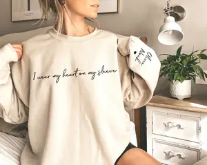 I Wear My Heart On My Sleeve Sweatshirt, Mothers Day Shirt, Mama Sweatshirt with Kids Name on Sleeve, Personalized Mother Day Hoodie and Sweater; T-shirt