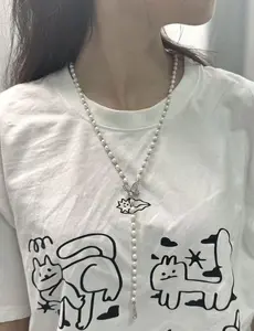 NC058-‘Papillon’ Lariat | A Freshwater Pearl & Butterfly Sautoir Necklace. pearl lariat necklace, pearl y necklace, long pearl necklace, sweater chain, sautoir necklace, butterfly necklace, freshwater pearl necklace, quiet luxury, elegant jewelry