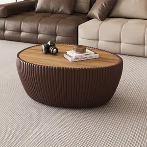 The marble top oval leather coffee table creates a modern and luxurious style. Durable and elegant, it is a great choice for modern living room furniture.
