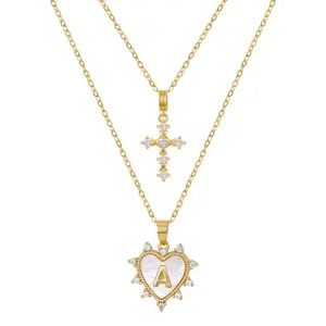 KissYan Layered Initial Heart Necklace for Women, 14K Gold Plated Natural White Shell Letter Pendant with Small CZ Cross Charm Jewelry