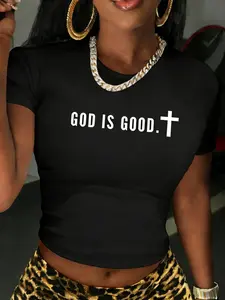 GOD IS GOOD' Religious Slogan Black Crop Top | Casual Christian Streetwear Top | Premium Soft Fabric | Bold Faithful Aesthetic | Trendy Slim-Fit Cropped Cut | Eye-Catching Text & Cross Print | Versatile Daily Wear | Perfect for Christian/Minimalist Style