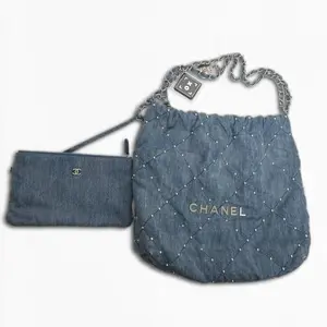 Pre-owned CHANEL Denim fabric with pearl embellishments Shoulder Bags 22 Hobo Shoulder Bag Light Blue Denim Fabric, Pearl Embellishments, Logo Accent, Roomy Size, Everyday Use, Pristine Condition, Style S022260405005