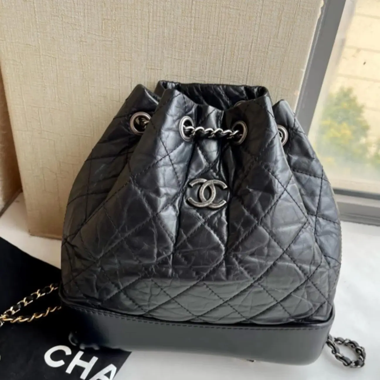 Pre-owned CHANEL 4586 Gabrielle Drawstring Bucket Shoulder Bag Black Crinkled Calfskin Leather, Aged Silver Hardware