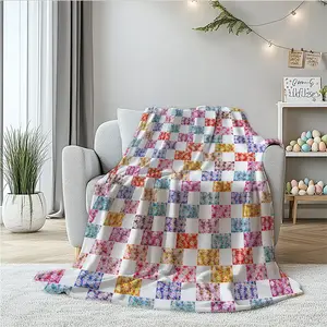 Colorful patchwork floral flannel blanket featuring high‑saturation pastel colors like pink, purple, yellow, blue, and green—rich yet harmonious hues that are both sweet and vibrant. Perfect as a sofa decorative throw, bedside blanket, or nap blanket for
