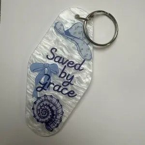 Saved by Grace Keychain with Blue Bow and Shell Design