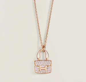 Pre-owned Hermes Amulettes Constance pendant，rose gold