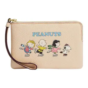 COACH x Peanuts Snoopy Wristlet with Zipper Closure, Pebbled Leather, and Cartoon Print in Ivory White for Women