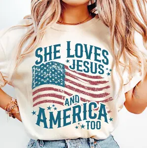 She Loves Jesus T-shirt, Vintage USA flag with bold faith quote, For proud Christian women, Classic American spirit style, 4th of July & church wear, Patriotic faith fashion top  Love