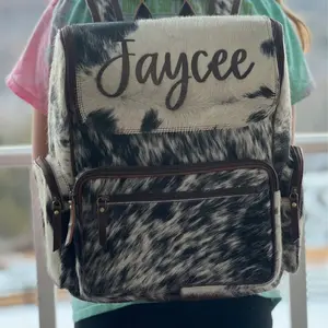 Cowhide backpack bookbag or diaper bag made with genuine cowhide