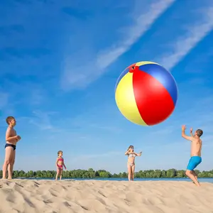 Giant oversized beach ball. A huge balloon, a massive 40-inch inflatable ball. A large rainbow-colored plastic toy, perfect for kids and adults. Great for summer pool games, backyard fun, and beach parties.