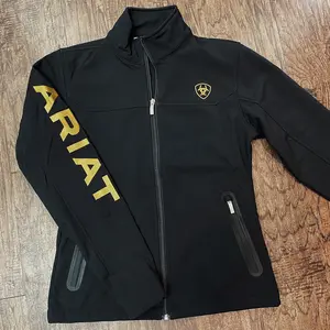 Ariat: Women New Black/Gold Team Softshell Brand Jacket Ariat: Women New Black/Gold Team Softshell Brand Jacket