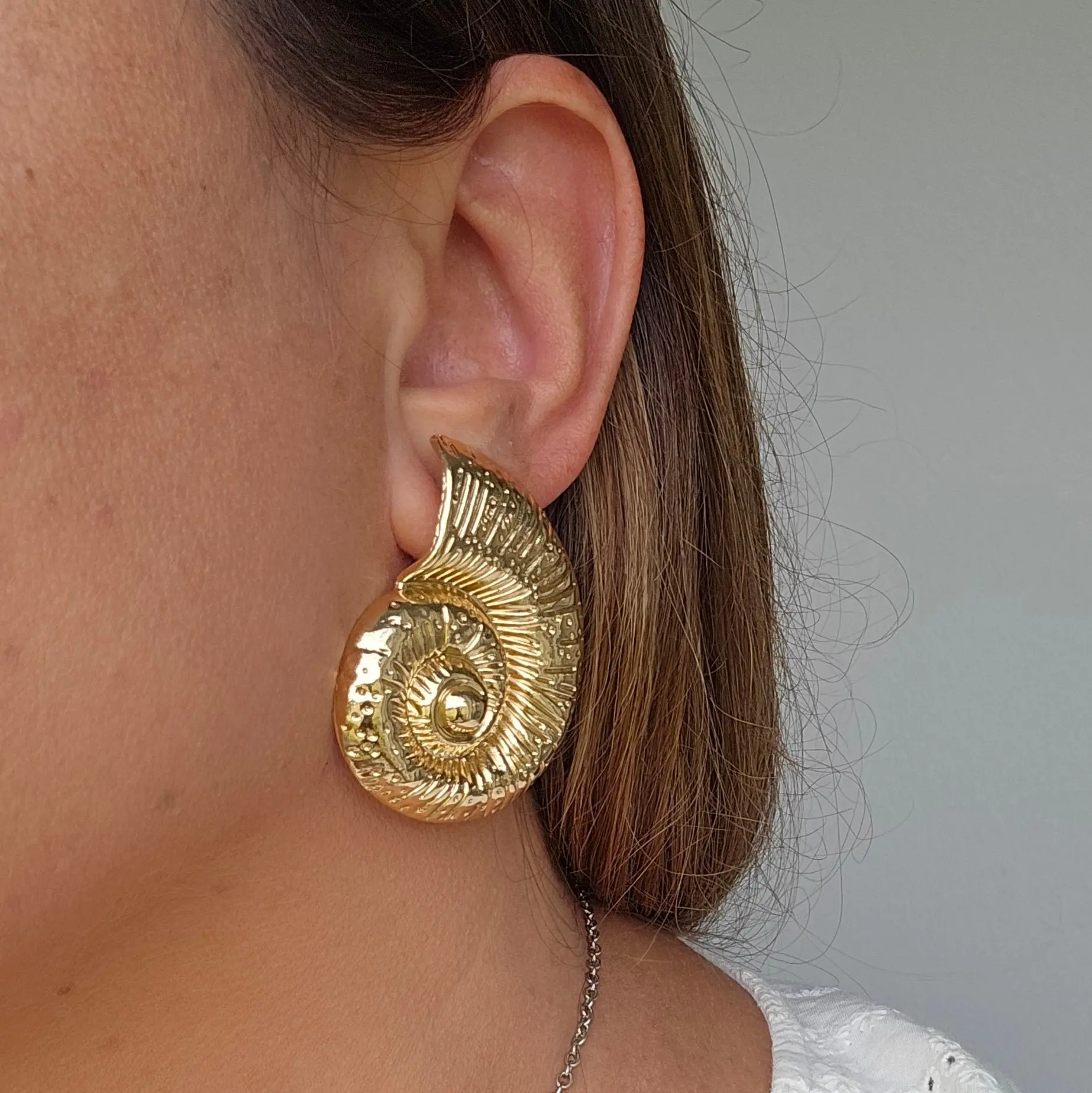 Ammonite Gold Shell earrings by Donatella
