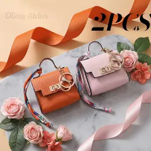 2-Piece Mini Bag Charm Set PVC waterproof material Luxury-inspired compact pouches Compact and portable Versatile styling Double as decorative charms or storage pouches Ideal for travel, outdoor adventures, or organizing keys, earbuds, and lipstick