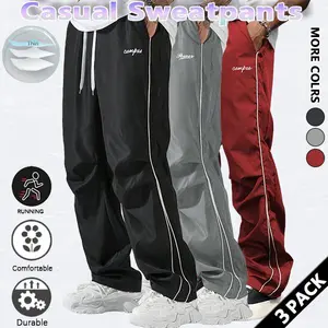 Loose-fitting sweatpants for men, grey side stripes with gold accent stripes, comfortable design, sports casual style bottoms, sweatpants, fitness wear, today's fashion outfit