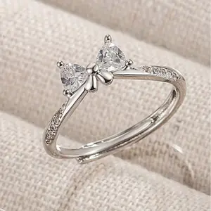 STAINLESS STEEL FASHIONABLE ELEGANT BOWNOT RING with Sparkling Cubic Zirconia Accents and Delicate Design