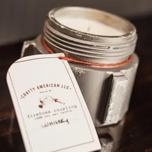Fire Hose Coupling Candle: The candle is made with soy wax and is scented "whiskey."  The candle is made from the ends of fire hose and each coupling candle has its own unique features or marks from the fire department it came from.