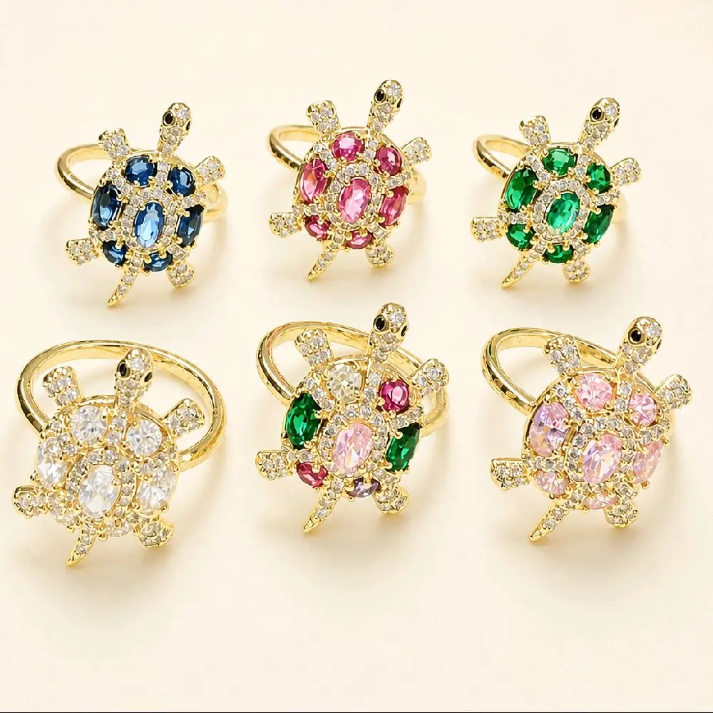 Anillos de tortugas con zirconias .Seis colores disponibles.  Laminado 14k