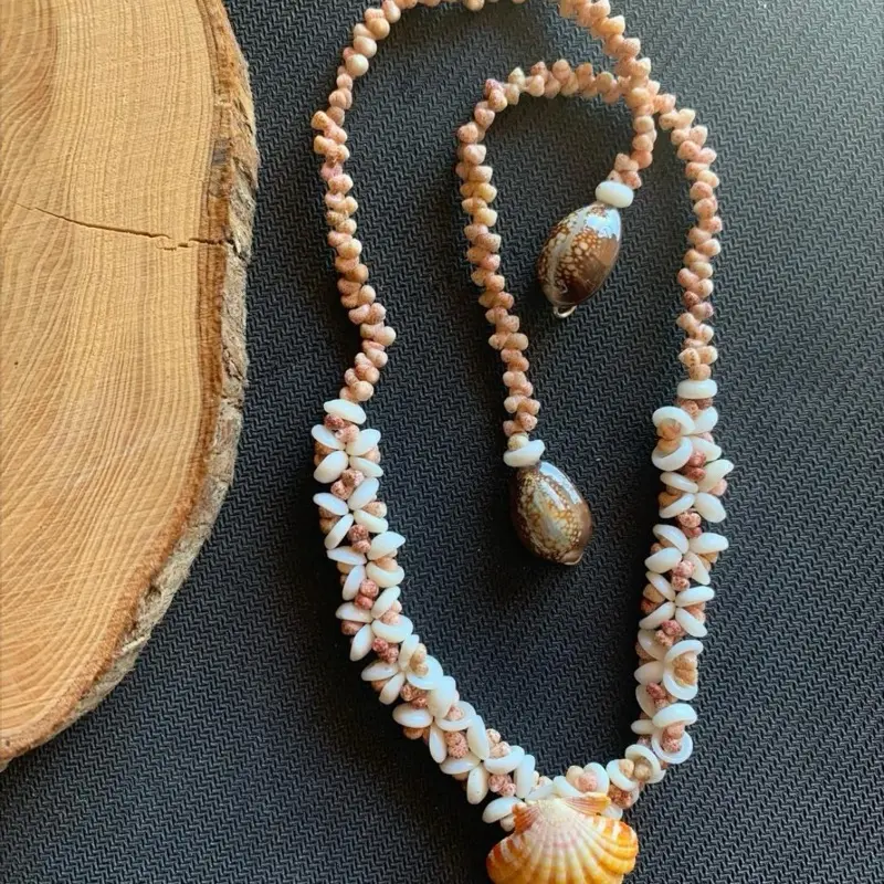 Hand crafted Puka Kahe shell lei plumeria style with sunrise