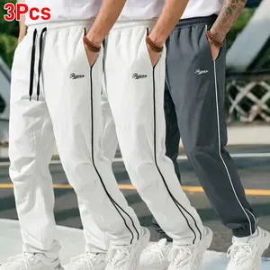 3-pack lightweight polyester men’s jogging pants, sweat-resistant and breathable, elastic waistband, single-side white stripe detailing, anti-shrink and colorfast, rolled hem design, suitable for travel, fits all male body types