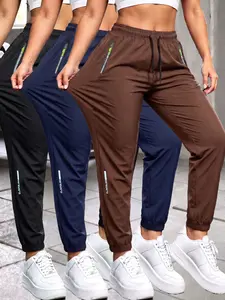 Women’s summer pants with zippered pockets and cuffed legs, featuring a stylish zipper design and an elastic waistband with an elastic band; casual outdoor everyday long pants. Womenswear