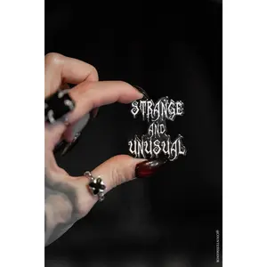 Strange and Unusual Enamel Pin