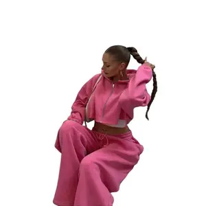 Women’s hot pink solid color two-piece set featuring a zip-up short hoodie and drawstring-waist sweatpants—casual fashion, comfortable and breathable, suitable for daily outdoor wear in autumn and winter; basic gamis style.