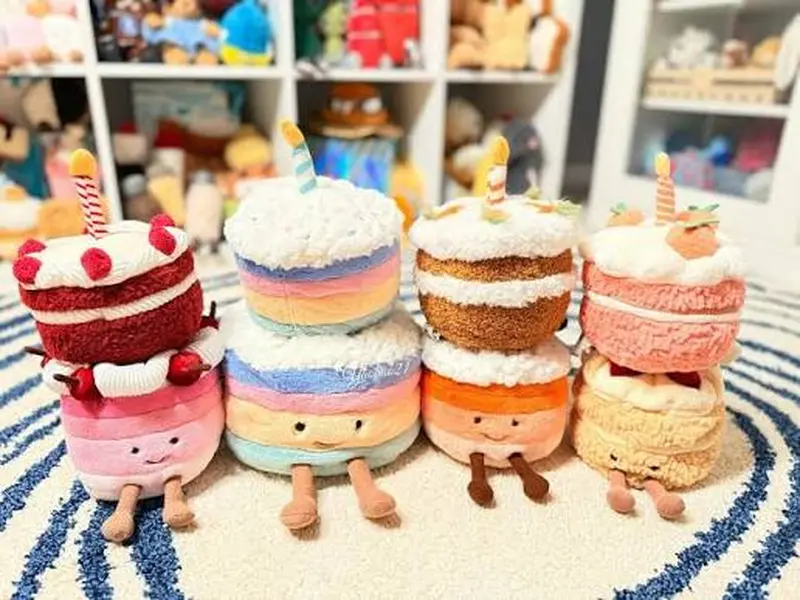 JELLYCAT Rainbow Birthday Cake Plush – An ultra-soft toy for little ones; a meaningful gift, a playful companion, and a lively room decoration.